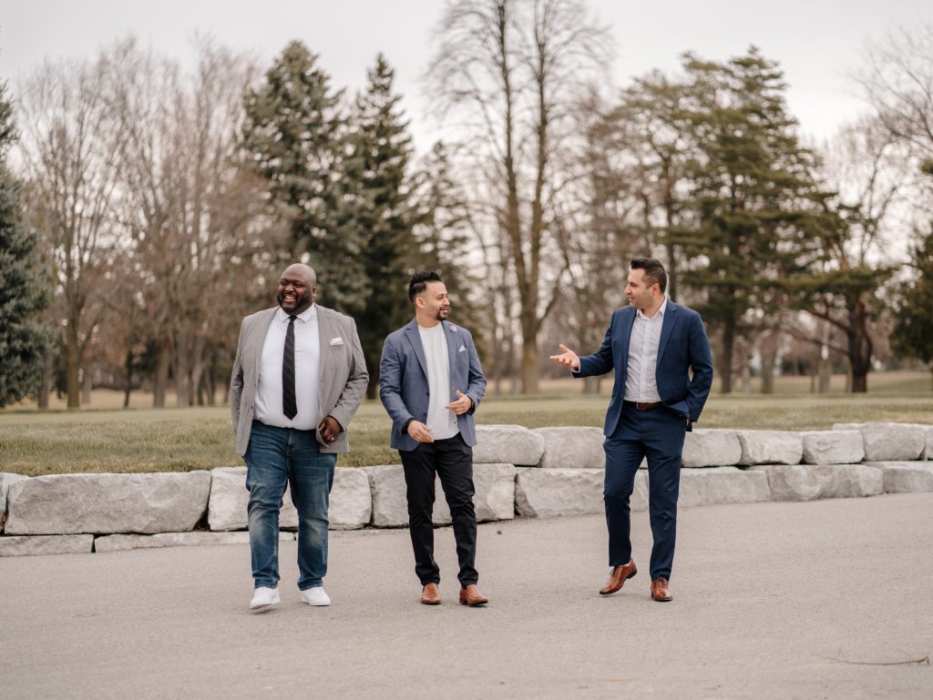 DR Group real estate team walking together and discussing homes in Durham Region